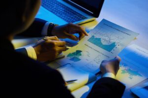 Hands of business executives analyzing company activity